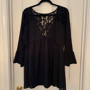 Black with lace top and bell sleeves.